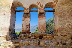 Lake Mikri Prespa through window of Basilica of Agios Achilleos  
